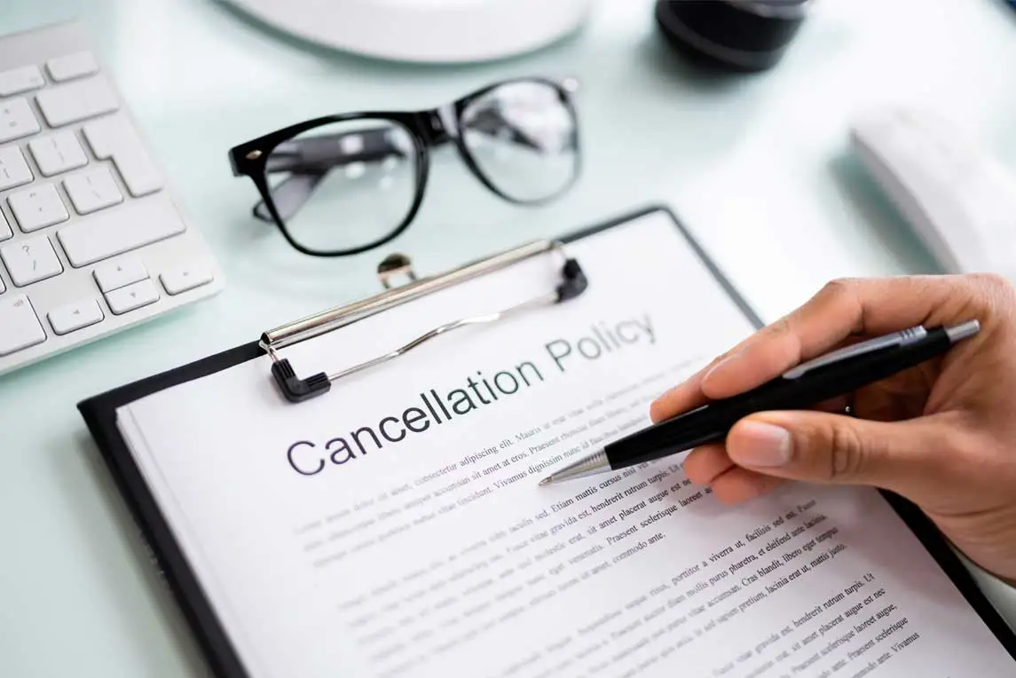 African Man Reading Business Cancel Policy And Regulation